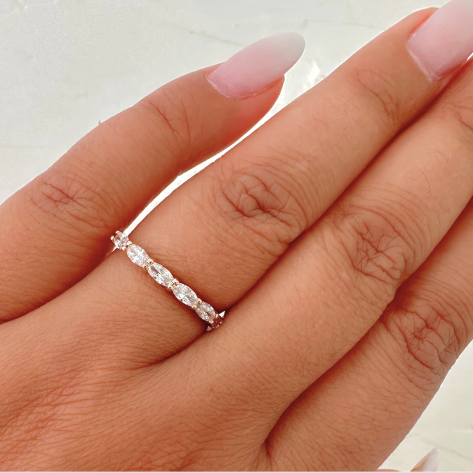 East West oval rose hand 1600x1600